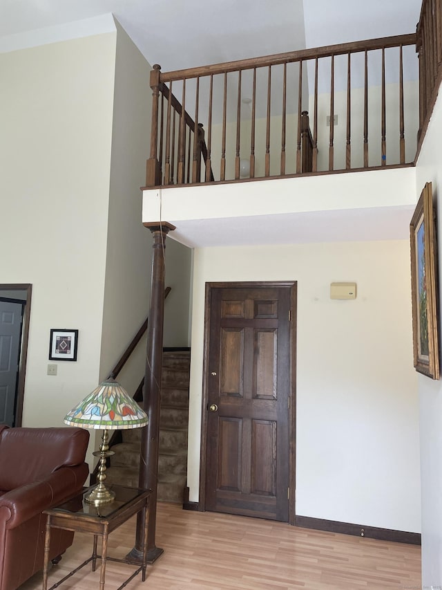 1433 Naugatuck Ave Unit 1433, Milford, CT 06461 - foyer with light wood-type flooring, baseboards, and a towering ceiling