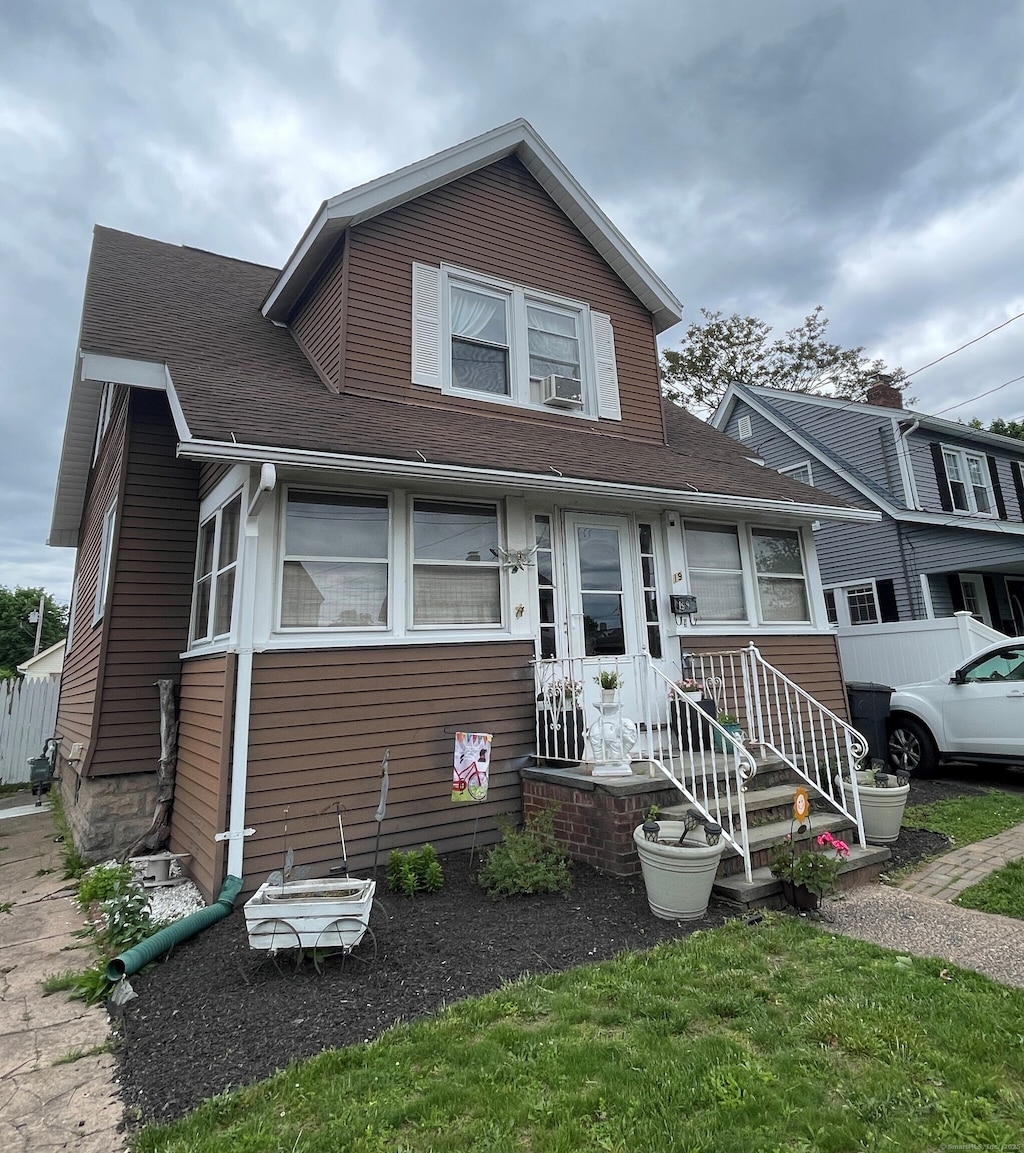 19 Marion St, West Haven, CT 06516 - view of front facade with roof with shingles and cooling unit