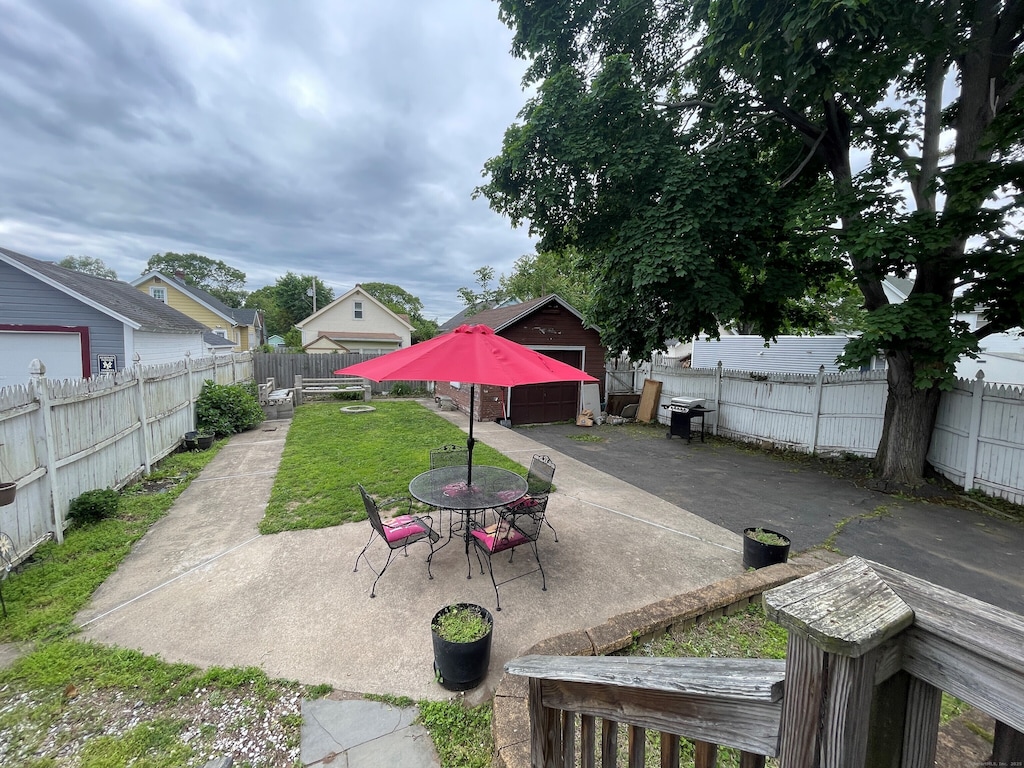 19 Marion St, West Haven, CT 06516 - fenced backyard with a patio and outdoor dining space