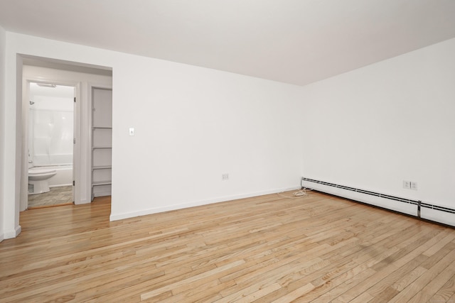 166 Wynola Ave, New Britain, CT 06051 - spare room with light wood-type flooring, baseboards, and a baseboard heating unit