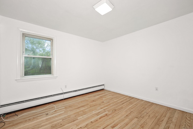 166 Wynola Ave, New Britain, CT 06051 - spare room featuring a baseboard heating unit, wood finished floors, and baseboards