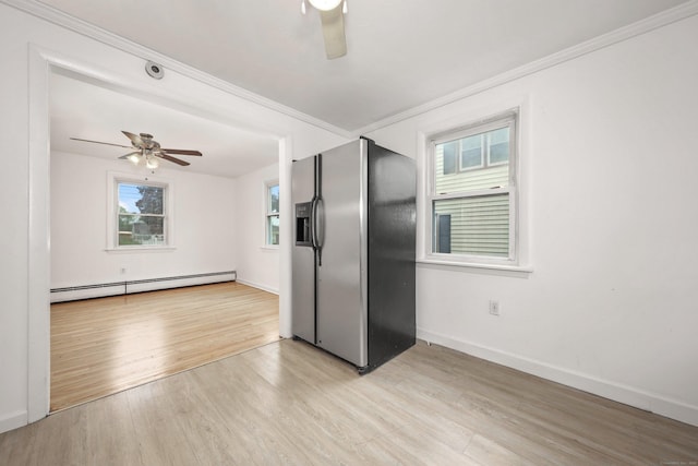 166 Wynola Ave, New Britain, CT 06051 - kitchen with a baseboard radiator, stainless steel fridge, a ceiling fan, light wood-style flooring, and baseboards