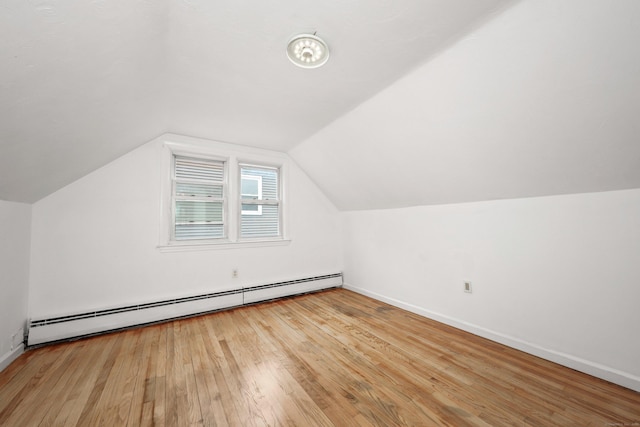 166 Wynola Ave, New Britain, CT 06051 - additional living space featuring baseboard heating, wood finished floors, baseboards, and vaulted ceiling