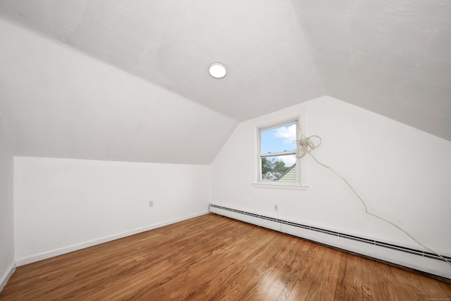 166 Wynola Ave, New Britain, CT 06051 - bonus room with a baseboard heating unit, wood finished floors, baseboards, and vaulted ceiling