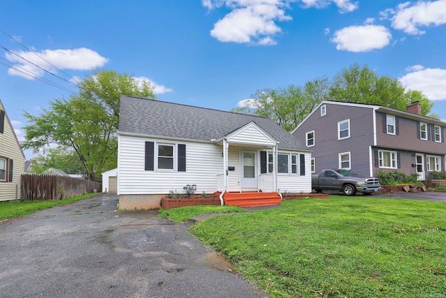 166 Wynola Ave, New Britain, CT 06051 - view of front of home with roof with shingles, a garage, and an outdoor structure