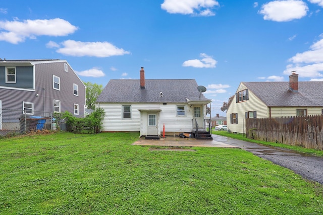 166 Wynola Ave, New Britain, CT 06051 - back of house featuring a patio and a chimney
