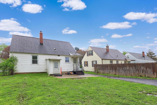 166 Wynola Ave, New Britain, CT 06051 - rear view of house featuring a patio and a chimney
