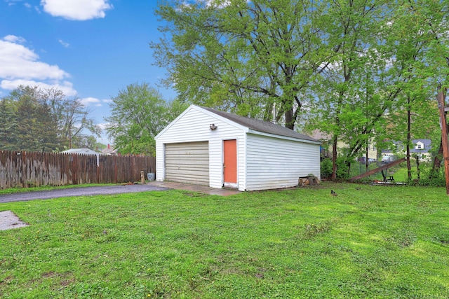 166 Wynola Ave, New Britain, CT 06051 - view of yard featuring driveway, an outbuilding, and a detached garage