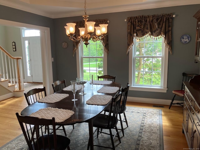 37 Ellsworth Ln, Ellington, CT 06029 - dining area featuring stairs, a chandelier, crown molding, light wood-type flooring, and baseboards