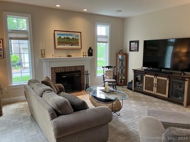 37 Ellsworth Ln, Ellington, CT 06029 - living area featuring a brick fireplace, light carpet, recessed lighting, and baseboards