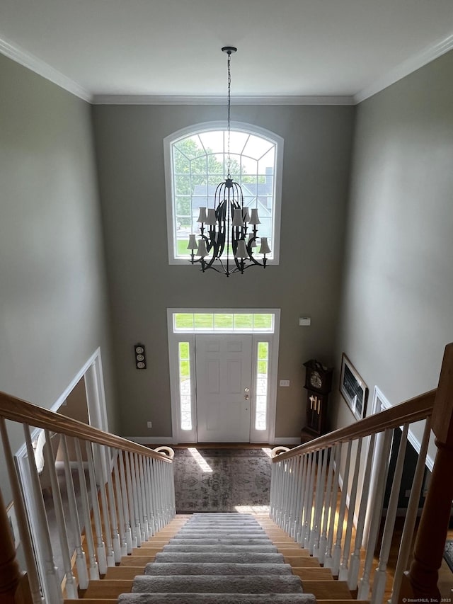 37 Ellsworth Ln, Ellington, CT 06029 - entryway featuring stairs, plenty of natural light, a chandelier, crown molding, and a towering ceiling
