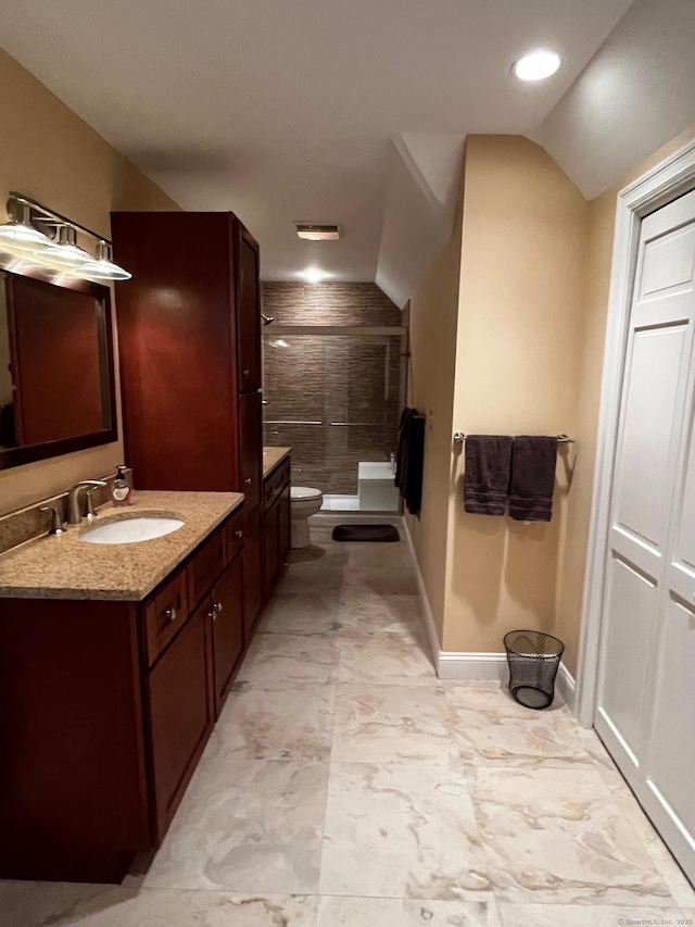 37 Ellsworth Ln, Ellington, CT 06029 - bathroom with a shower stall, vanity, toilet, vaulted ceiling, and baseboards