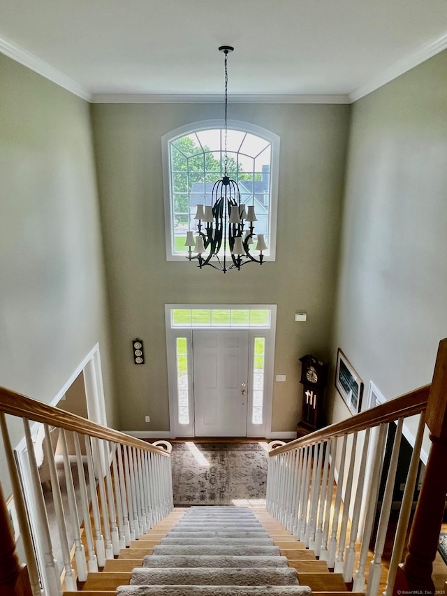 37 Ellsworth Ln, Ellington, CT 06029 - entrance foyer with stairway, healthy amount of natural light, wood finished floors, ornamental molding, and a towering ceiling