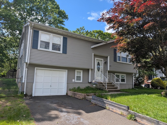 13 Dora Dr, East Haven, CT 06513 - raised ranch with an attached garage and asphalt driveway