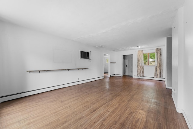 4 Meadow Rd, Enfield, CT 06082 - unfurnished living room featuring wood finished floors, a baseboard radiator, and a wall mounted AC