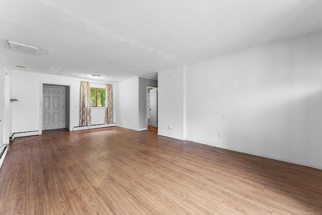 4 Meadow Rd, Enfield, CT 06082 - spare room with baseboard heating, wood finished floors, a baseboard heating unit, and baseboards