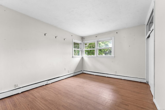 4 Meadow Rd, Enfield, CT 06082 - unfurnished bedroom featuring wood finished floors and baseboard heating