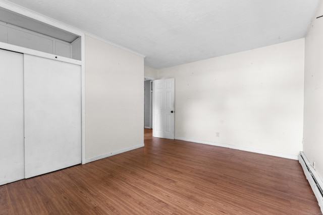 4 Meadow Rd, Enfield, CT 06082 - unfurnished bedroom featuring a baseboard radiator, wood finished floors, a closet, and baseboards