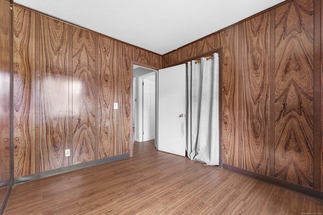 4 Meadow Rd, Enfield, CT 06082 - empty room featuring wood finished floors, wood walls, and baseboards