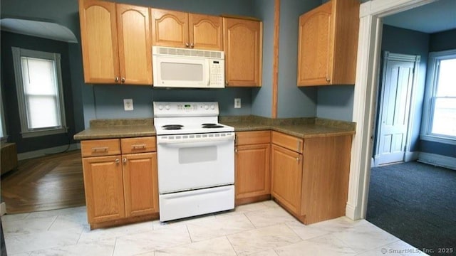 48 Moore Ave, New London, CT 06320 - kitchen with white appliances, dark countertops, radiator, and baseboards