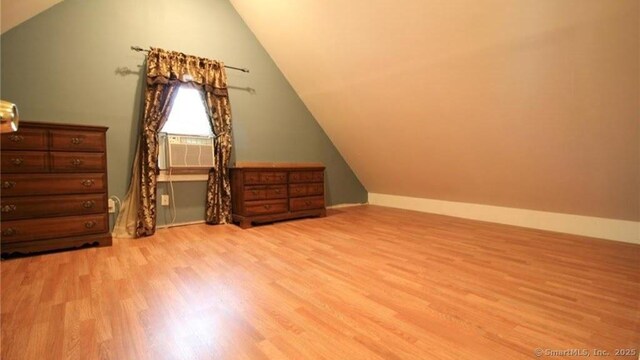 48 Moore Ave, New London, CT 06320 - additional living space featuring light wood-style flooring, cooling unit, vaulted ceiling, and baseboards
