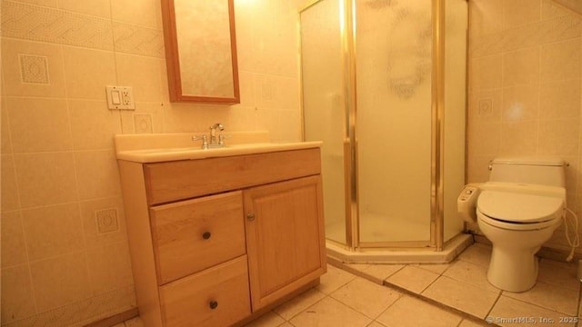 48 Moore Ave, New London, CT 06320 - bathroom with vanity, a stall shower, tile walls, toilet, and tile patterned flooring