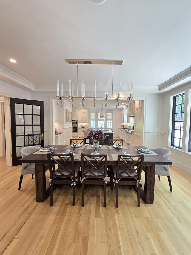 20 Crawford Rd, Westport, CT 06880 - dining room featuring light wood-style floors, ornamental molding, a wainscoted wall, a decorative wall, and recessed lighting