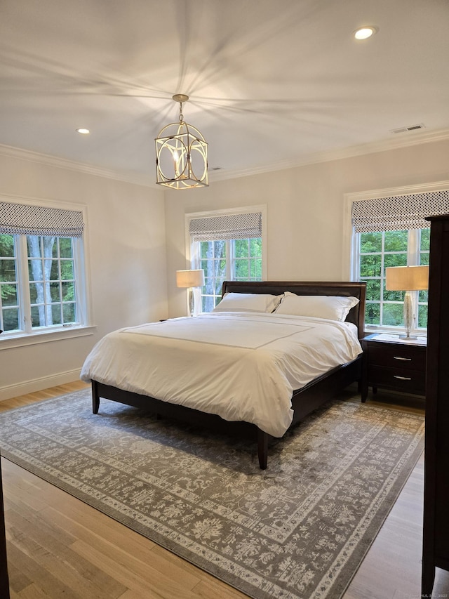 20 Crawford Rd, Westport, CT 06880 - bedroom with multiple windows, crown molding, a chandelier, wood finished floors, and recessed lighting