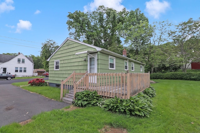 52 Fairview Ave, Bristol, CT 06010 - view of front of house featuring a front yard and a chimney