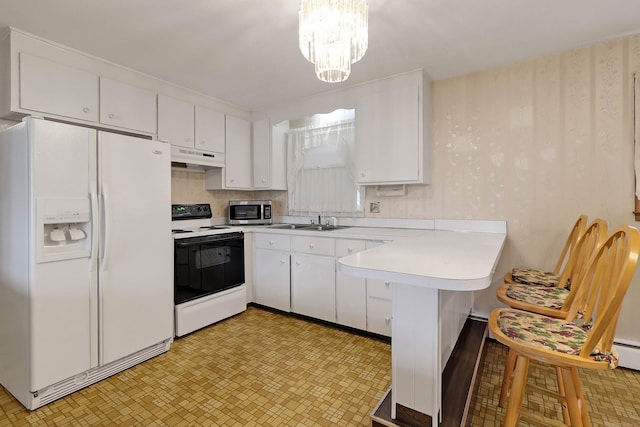 52 Fairview Ave, Bristol, CT 06010 - kitchen featuring white fridge with ice dispenser, electric stove, stainless steel microwave, under cabinet range hood, and a peninsula