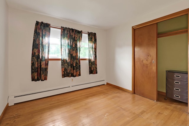 52 Fairview Ave, Bristol, CT 06010 - unfurnished bedroom with baseboard heating, light wood-type flooring, and baseboards