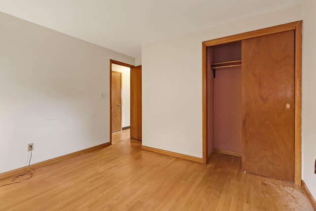 52 Fairview Ave, Bristol, CT 06010 - unfurnished bedroom featuring light wood-type flooring, baseboards, and a closet