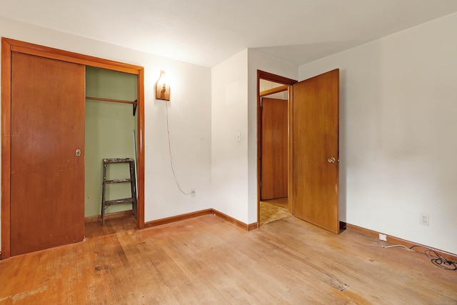 52 Fairview Ave, Bristol, CT 06010 - unfurnished bedroom featuring light wood-style floors, baseboards, and a closet