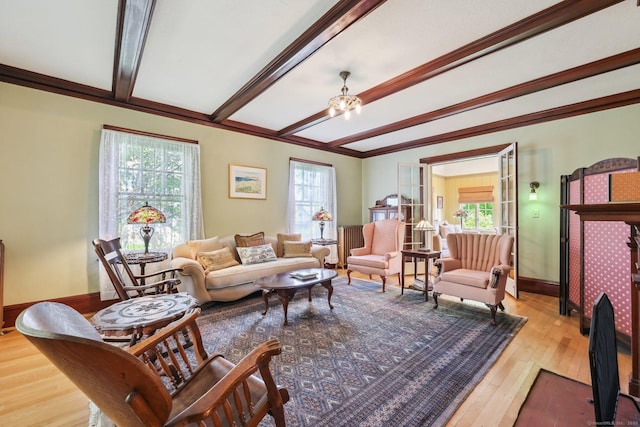 222 N Beacon St, Hartford, CT 06105 - living room featuring beam ceiling, plenty of natural light, hardwood / wood-style floors, a chandelier, and crown molding