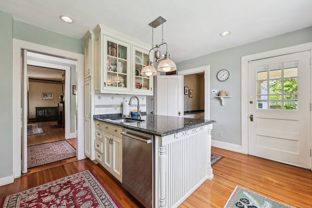 222 N Beacon St, Hartford, CT 06105 - kitchen featuring dishwasher, a sink, glass insert cabinets, wood finished floors, and recessed lighting