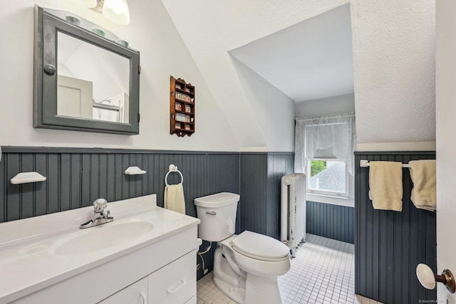 222 N Beacon St, Hartford, CT 06105 - bathroom featuring radiator heating unit, toilet, a wainscoted wall, vanity, and tile patterned floors