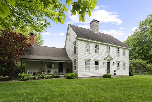 7 Shelter Rock Rd, East Haddam, CT 06423 - view of front of house featuring a chimney, a front yard, a shingled roof, and covered porch