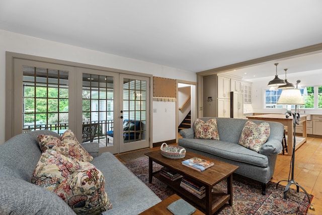 7 Shelter Rock Rd, East Haddam, CT 06423 - living area with french doors, light wood-style flooring, and stairway