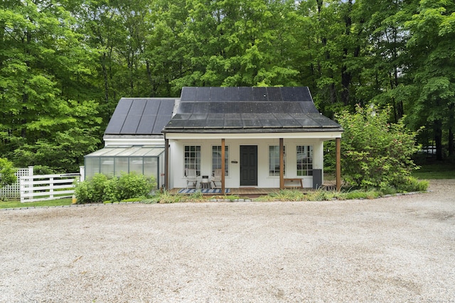 7 Shelter Rock Rd, East Haddam, CT 06423 - view of front of property featuring an exterior structure, a standing seam roof, a porch, an outdoor structure, and metal roof