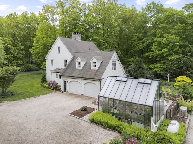 7 Shelter Rock Rd, East Haddam, CT 06423 - view of front of house with an exterior structure, asphalt driveway, a front lawn, a chimney, and an outbuilding