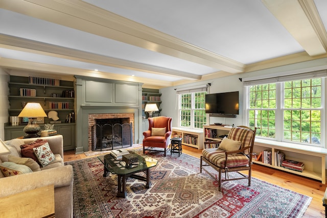 7 Shelter Rock Rd, East Haddam, CT 06423 - living area with beamed ceiling, a brick fireplace, and wood finished floors