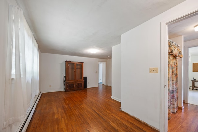 205 Allentown Rd, Plymouth, CT 06786 - unfurnished living room with wood finished floors, baseboard heating, and baseboards