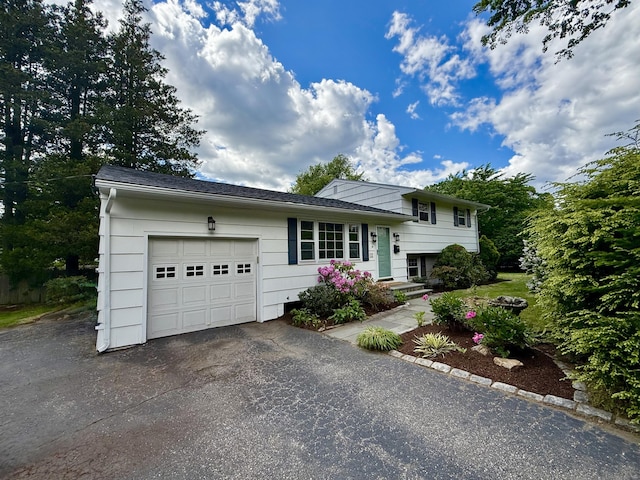 12 Sugar Plum Ln, Fairfield, CT 06824 - view of front of property with an attached garage and asphalt driveway