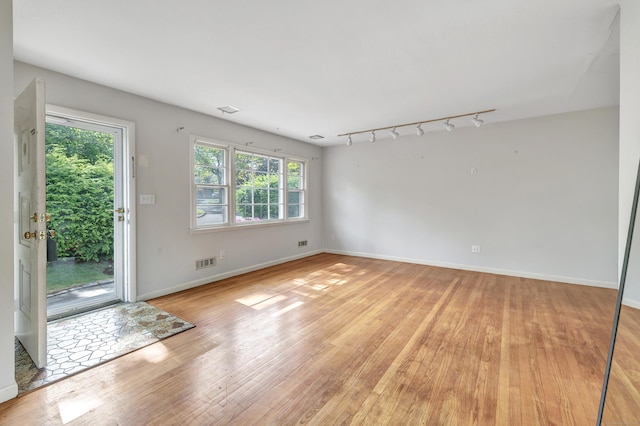 12 Sugar Plum Ln, Fairfield, CT 06824 - unfurnished room with light wood-type flooring, baseboards, and track lighting