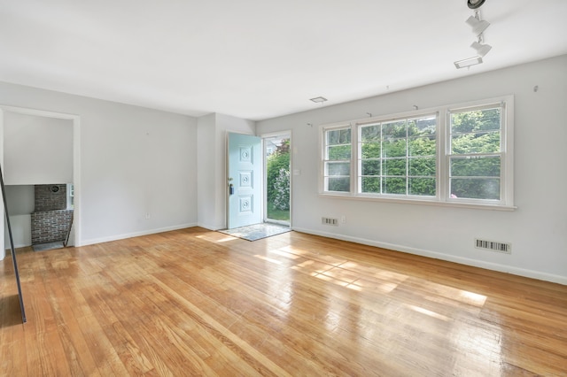 12 Sugar Plum Ln, Fairfield, CT 06824 - unfurnished living room featuring light wood-style flooring and baseboards