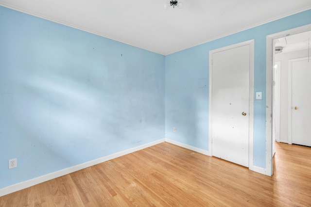 12 Sugar Plum Ln, Fairfield, CT 06824 - spare room featuring attic access, wood finished floors, baseboards, and ornamental molding