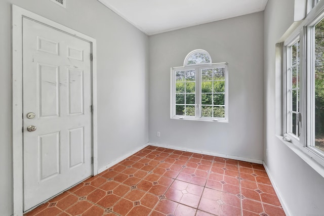 12 Sugar Plum Ln, Fairfield, CT 06824 - empty room featuring healthy amount of natural light, baseboards, and dark tile patterned floors
