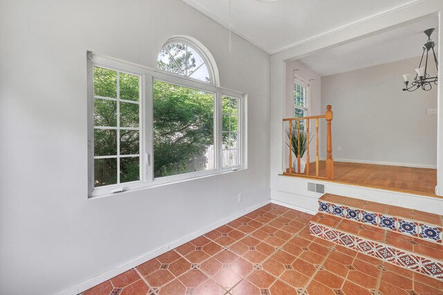 12 Sugar Plum Ln, Fairfield, CT 06824 - spare room with baseboards, vaulted ceiling, and a chandelier