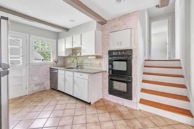 12 Sugar Plum Ln, Fairfield, CT 06824 - kitchen with stainless steel appliances, a sink, light countertops, white cabinets, and backsplash