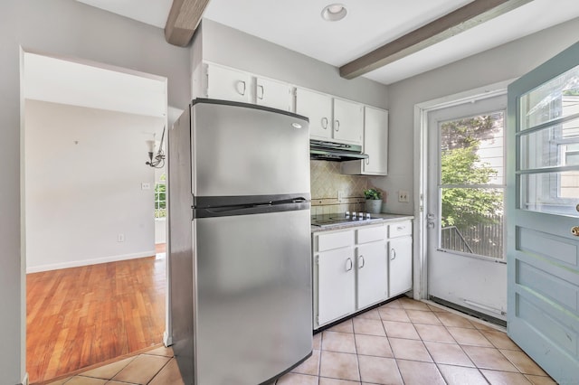 12 Sugar Plum Ln, Fairfield, CT 06824 - kitchen featuring freestanding refrigerator, under cabinet range hood, black electric cooktop, beam ceiling, and white cabinetry
